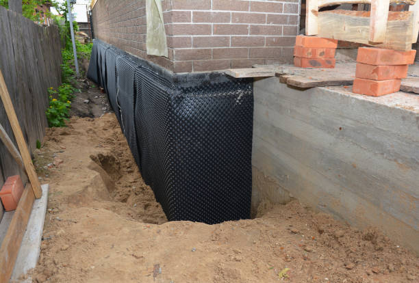 Happy homeowners after waterproofing job in Metamora